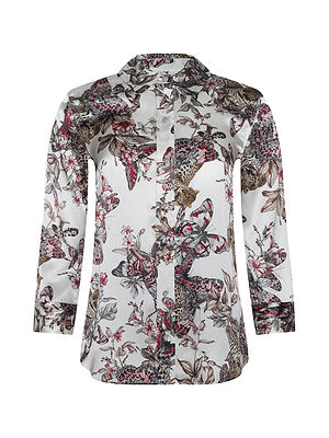 The Dani Silk Blouse is a long-sleeve, button-down top with a white base and butterfly jungle print in brown, red, and black. It features a pointed collar and a slightly curved hem for an elegant touch.