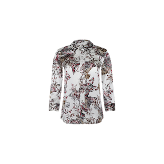 The Dani Silk Blouse features long sleeves and a white background adorned with an intricate butterfly jungle print, showcasing floral and bird motifs in shades of pink, brown, and green.