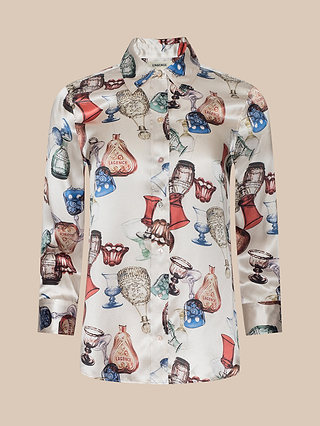 The Dani Silk Blouse is a long-sleeve, button-down top adorned with a print of multicolored vintage perfume bottles and glassware on a light background.