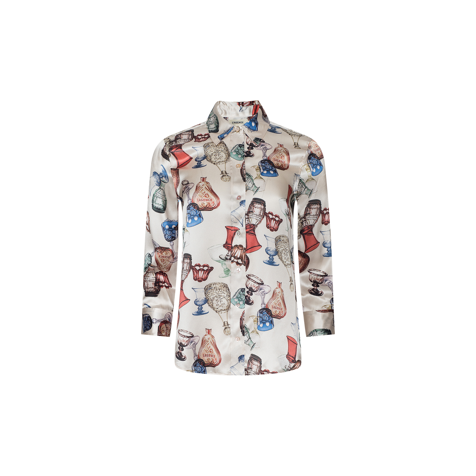 The Dani Silk Blouse is a long-sleeve, button-down silk shirt featuring a colorful vintage glassware print of lamps, clocks, and vases on a white background.