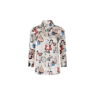The Dani Silk Blouse is a long-sleeve button-down shirt crafted from silk, featuring a white base adorned with vibrant illustrations of vintage glassware—including wine glasses and goblets—in shades of red, blue, and brown.