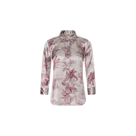 A Dani Silk Blouse with long sleeves, a button-up front, and a collar, showcasing a pink and white jungle toile print on a light background, displayed on a plain white surface.