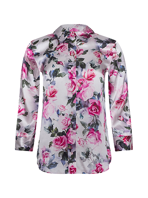 The Dani Silk Blouse is a long-sleeve, collared button-down in light-colored shiny silk, featuring a vibrant pink rose and green floral print—an elegant touch of sophistication for any wardrobe.