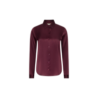 The Tyler Silk Blouse is a long-sleeved, button-up shirt in merlot red silk charmeuse, featuring a pointed collar and shown against a plain white background.