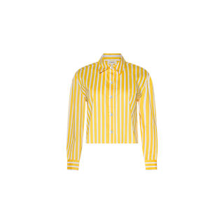 The Cosette Shirt is a yellow and white vertically striped, long-sleeve, button-up tailored shirt with a collar and a cropped high-low hem, displayed on a plain white background.