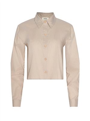The Cosette Shirt is a beige, long-sleeve tailored shirt with a classic collar and subtle vertical pinstripes, made from organic cotton and shown on a plain white background.