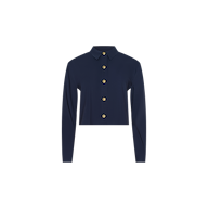 The Cosette Shirt is a navy blue, long-sleeved, collared tailored shirt featuring gold buttons down the front. It is neatly buttoned and displayed on a plain white background.