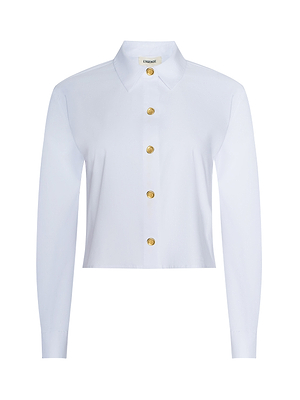 The Cosette Shirt is a white, long-sleeve cropped design in organic cotton poplin with a collared neckline and gold front buttons, shown against a plain white background.