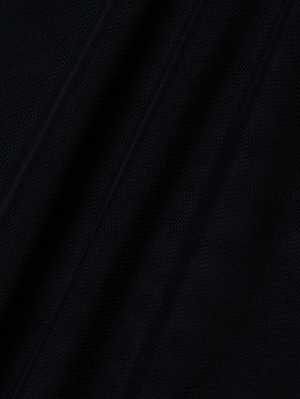 Close-up of the Trista Bodysuit by L'AGENCE: black fabric with diagonal folds and subtle texture, similar to mesh. Gentle shadows and highlights add depth to this sleek design.