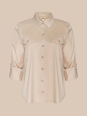The Pearson Poplin Blouse is a beige, utility-inspired shirt featuring long sleeves, a collar, two flap chest pockets, and rolled-up sleeves with buttoned tabs, shown against a plain background.