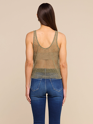 A person with long brown hair is shown from the back, wearing the Zia Tank and blue jeans against a plain beige background.