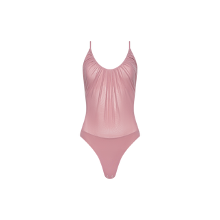 The Gelina Mesh Bodysuit in light pink features thin adjustable shoulder straps, a softly gathered front detail, and a high-cut leg, displayed against a plain white background.