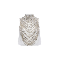 Yun Draped Crystal Tank in ivory features multiple layers of silver chains draped across the front and around the high neckline, creating a striking, statement look.