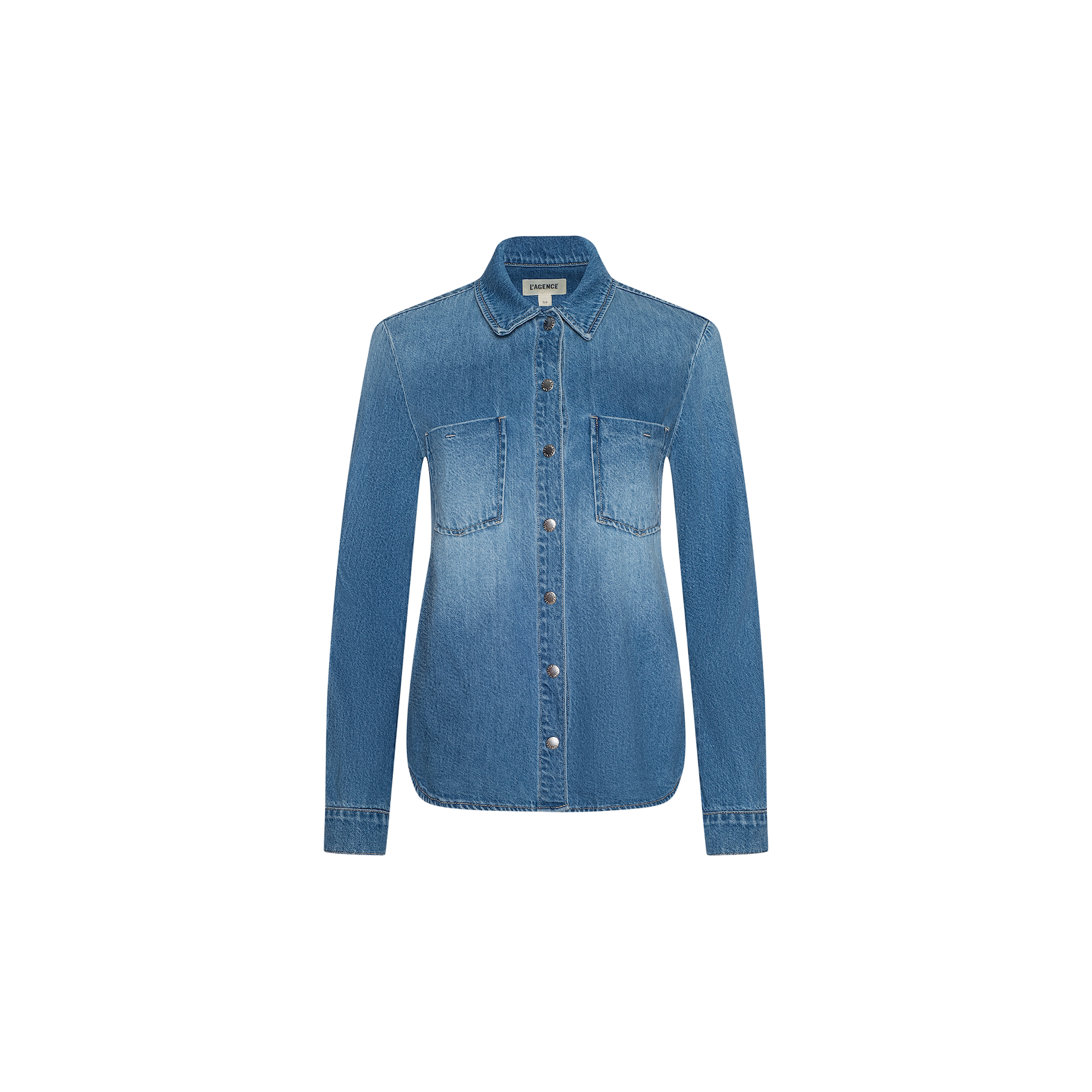 Introducing the Isla Shirt—a lightweight, long-sleeve denim button-up in an aged indigo wash, detailed with two chest pockets and photographed against a crisp white background. Effortlessly channel the laid-back style spotted at Spring 2026 NYFW with this versatile piece.