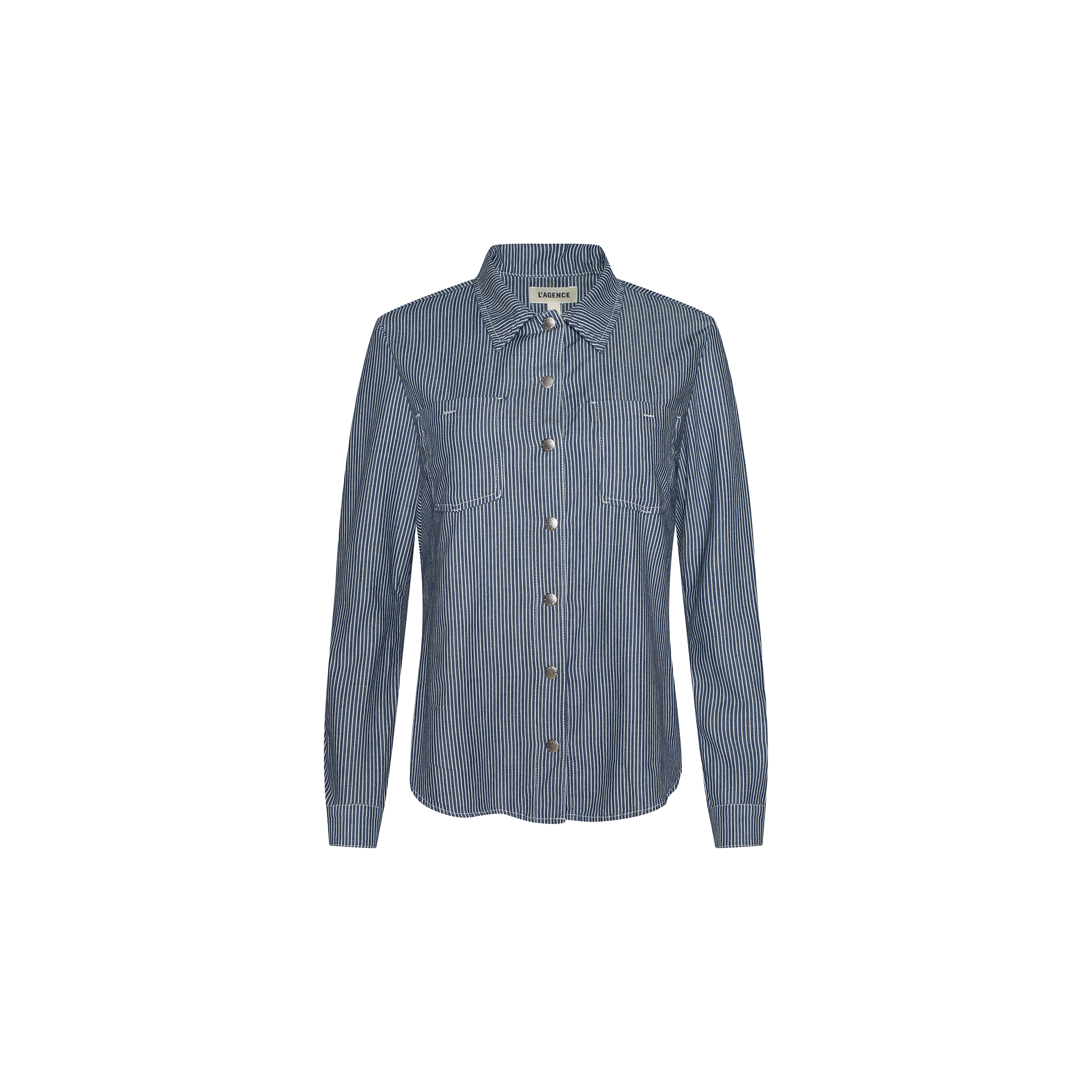The Isla Shirt by L’AGENCE is a featherweight denim long-sleeve button-up, featuring vertical white pinstripes and two chest pockets in an indigo wash, showcased against a plain white background.