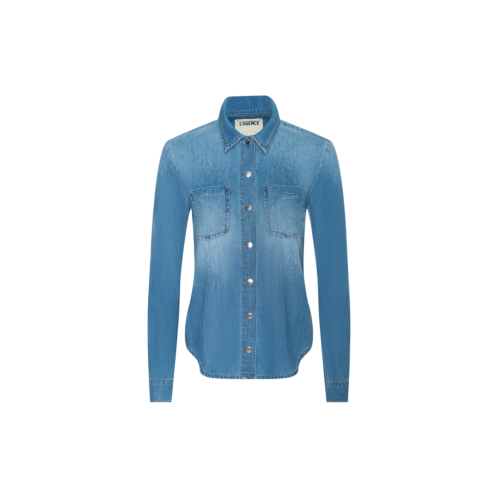 The Isla Shirt is a long-sleeved, light blue vintage wash denim shirt featuring two chest pockets and a collar, displayed on a plain white background.