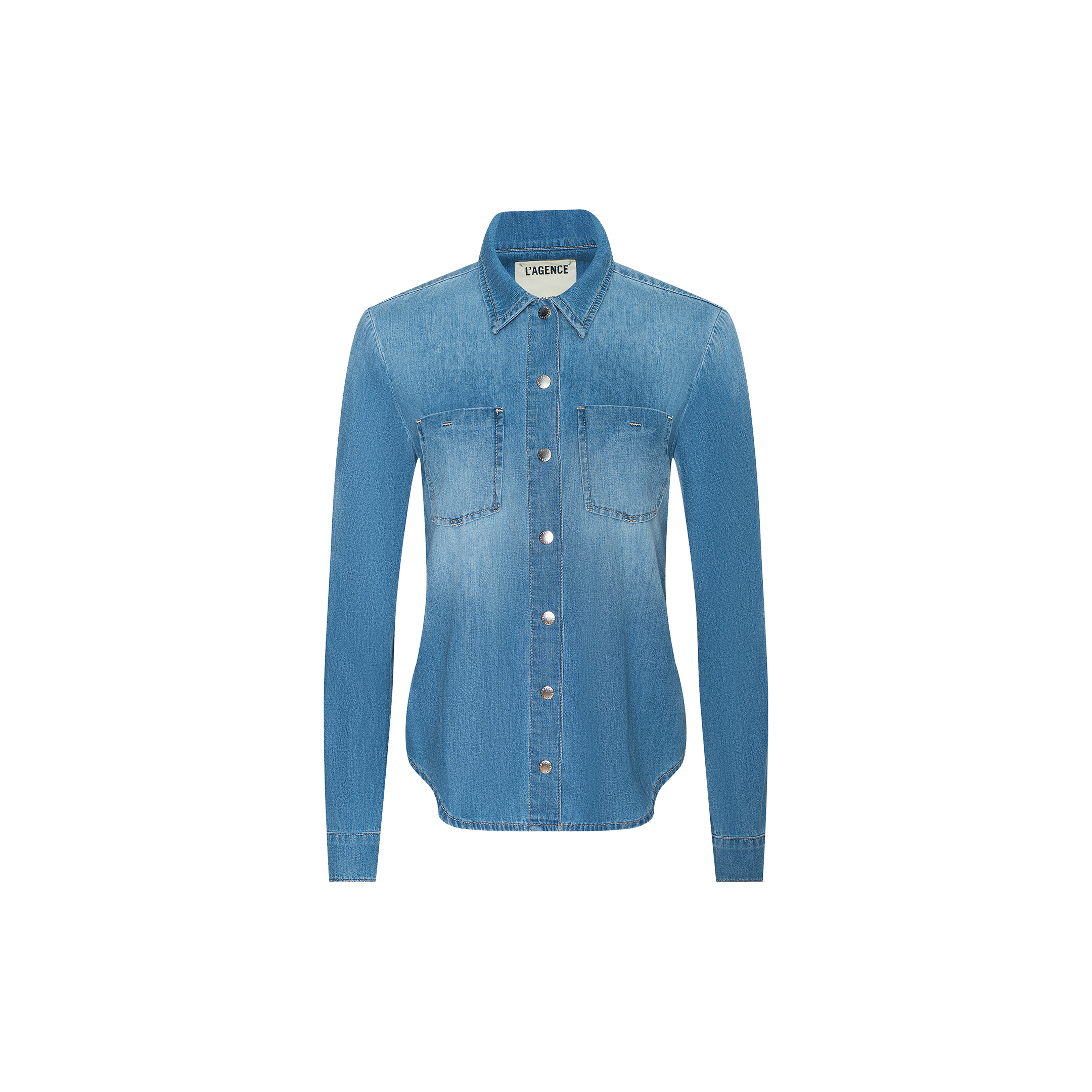 The Isla Shirt is a long-sleeved, light blue vintage wash denim shirt featuring two chest pockets and a collar, displayed on a plain white background.