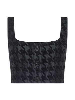 The Maylin Houndstooth Top by L'AGENCE is a black chenille jacquard bralette with a bold pattern, square neckline, wide shoulder straps, and three front buttons.