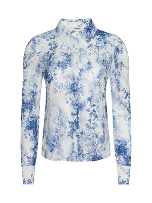 The Maia Lace Blouse is a long-sleeve button-up with a classic collar and a navy floral print on a light background, offering timeless style.