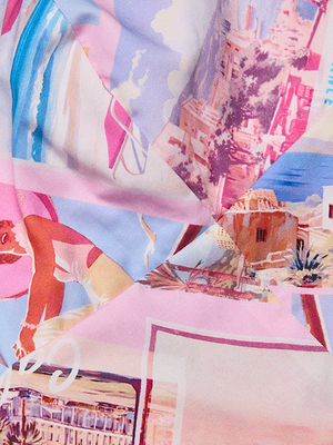 The Kaori Bralette Top showcases a colorful, abstract pattern with retro-style women, buildings, and seaside postcard scenes in pink, blue, and purple on creased fabric.