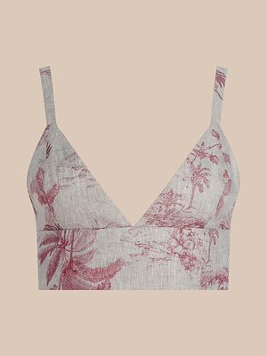 The Kaori Linen Bralette Top features wide straps and a deep V-neckline, showcasing a red jungle toile print of scenic countryside on a light beige background.