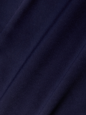 Close-up of dark blue fabric with diagonal lines and a soft, velvety texture, evoking the luxurious finish of the Dara Stretch-Satin Bodysuit and creating subtle highlights and shadows across its surface.