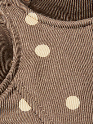 Close-up of brown lightweight twill with cream cardamom polka dots and visible seams, showcasing the Sonya Bustier garment.
