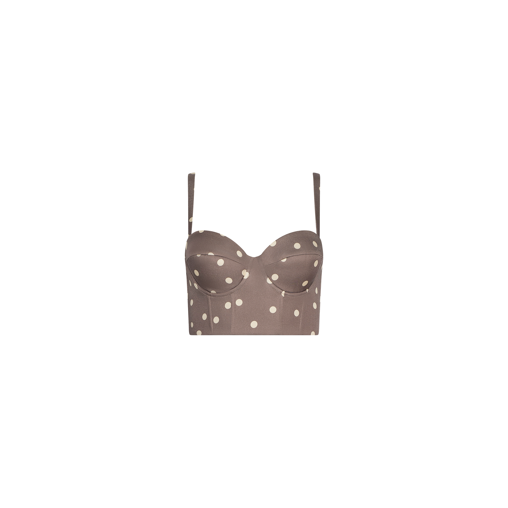 The Sonya Bustier is a brown cropped top made from lightweight twill, featuring thin adjustable straps, a smocked back, and a cardamom polka dot pattern, displayed on a plain white background.