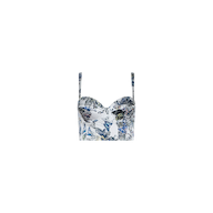 The Sonya Silk Bustier features a fitted silhouette with blue and green botanical prints on a white background. This bustier top includes thin shoulder straps and a sweetheart neckline, all showcased against a plain white backdrop.