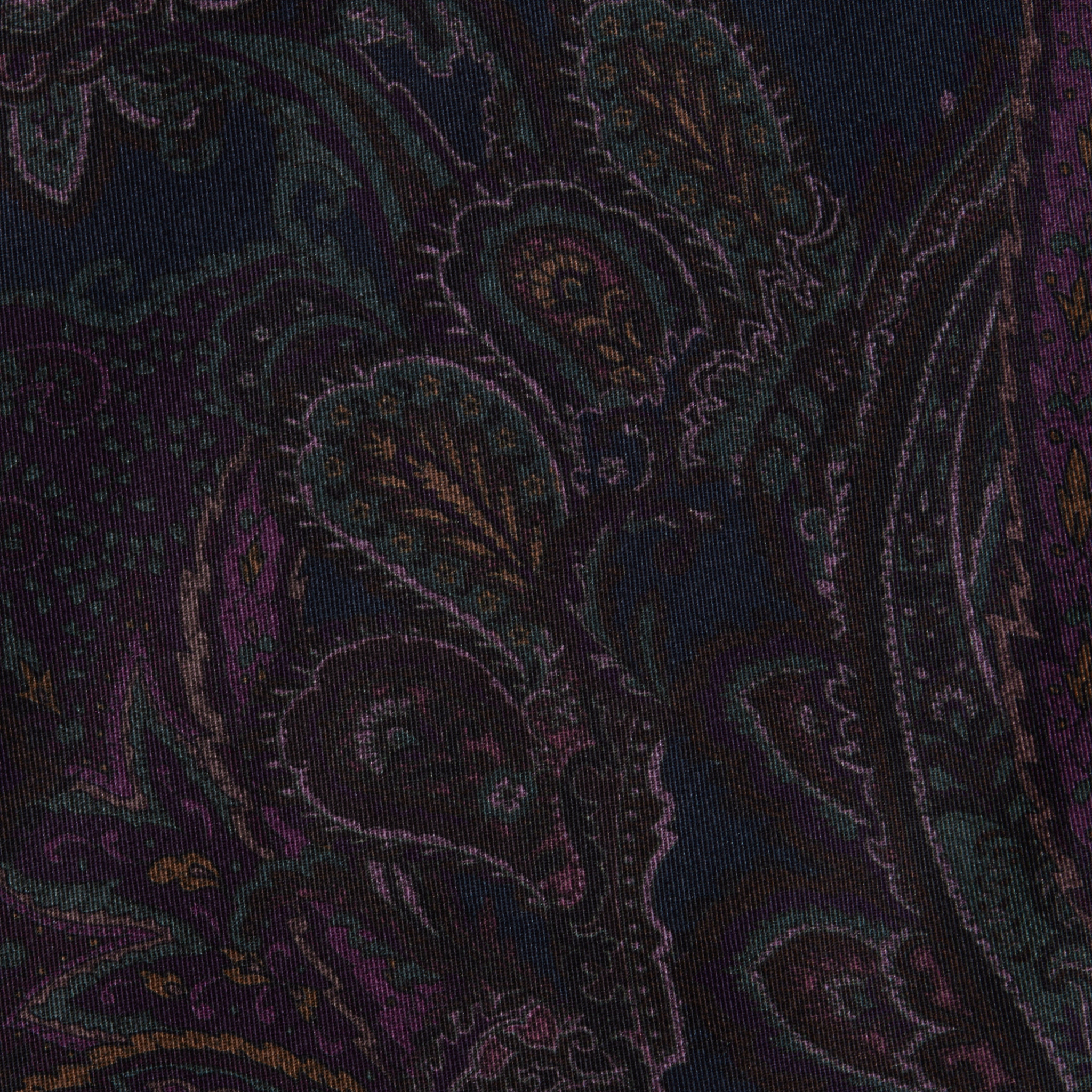 The Sonya Bustier features a dark navy paisley fabric with intricate, swirling patterns in shades of purple, green, and gold on a black background, creating an ornate and textured appearance.