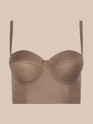 The Sonya Linen-Blend Bustier is a brown structured top with thin straps, defined cups, and a smocked back, shown against a beige background.