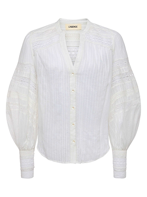 The Kiera Blouse by L’AGENCE is a white bohemian top featuring long voluminous sleeves, semi-sheer jacquard with lace panels, a V-neckline with geometric trim, front button closure, and branded collar label.