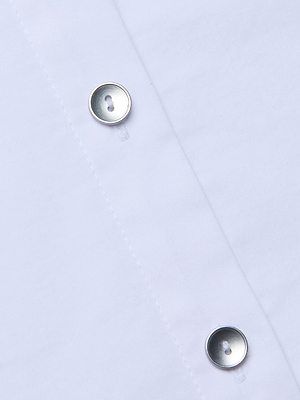 Close-up of the Fawn Panther Print Shirt's cotton fabric, highlighting two metallic buttons and vertical stitching.