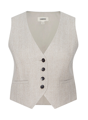 The Jianna Vest is a light beige, tailored women’s vest with a herringbone pattern, V-neckline, four dark buttons, and two slit pockets—a chic nod to historical romance from New York Fashion Week, Fall 2026.