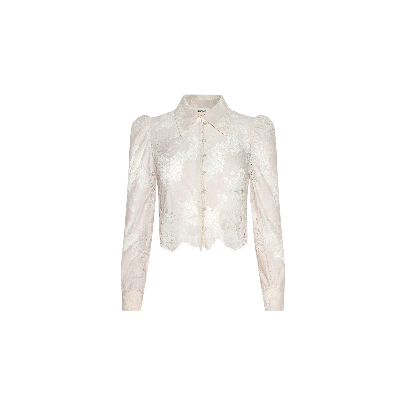 Introducing the Anita Lace Blouse: a sheer white floral lace blouse featuring long sleeves, a pointed collar, and front button closures. This cropped design showcases a slightly scalloped hem and is crafted from delicate, semi-transparent fabric.