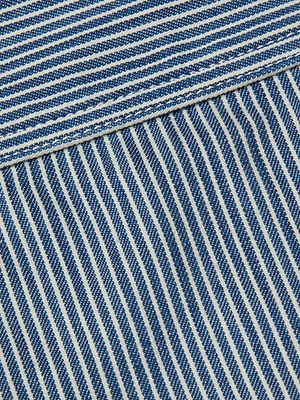 Close-up of the Arlin Tank, featuring blue and white striped fabric with a horizontal seam where the stripe direction changes. The woven texture is clearly visible.