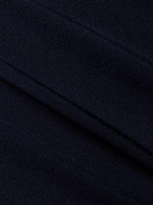 Close-up of the dark navy Kimber Silk Lace Camisole by L'AGENCE, showcasing its soft, subtly textured fabric and elegant diagonal lines—ideal for a chic cropped look.