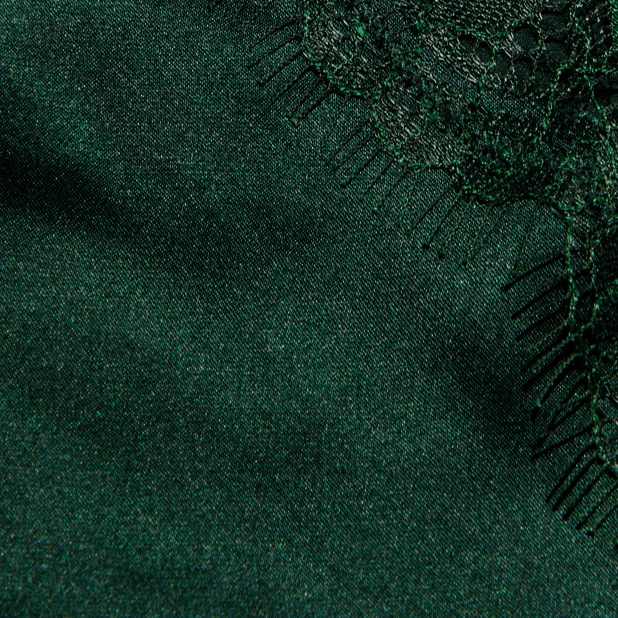 Close-up of the dark green Kimber Silk Lace Camisole, featuring a deep V-neckline and intricate lace trim along the edge.