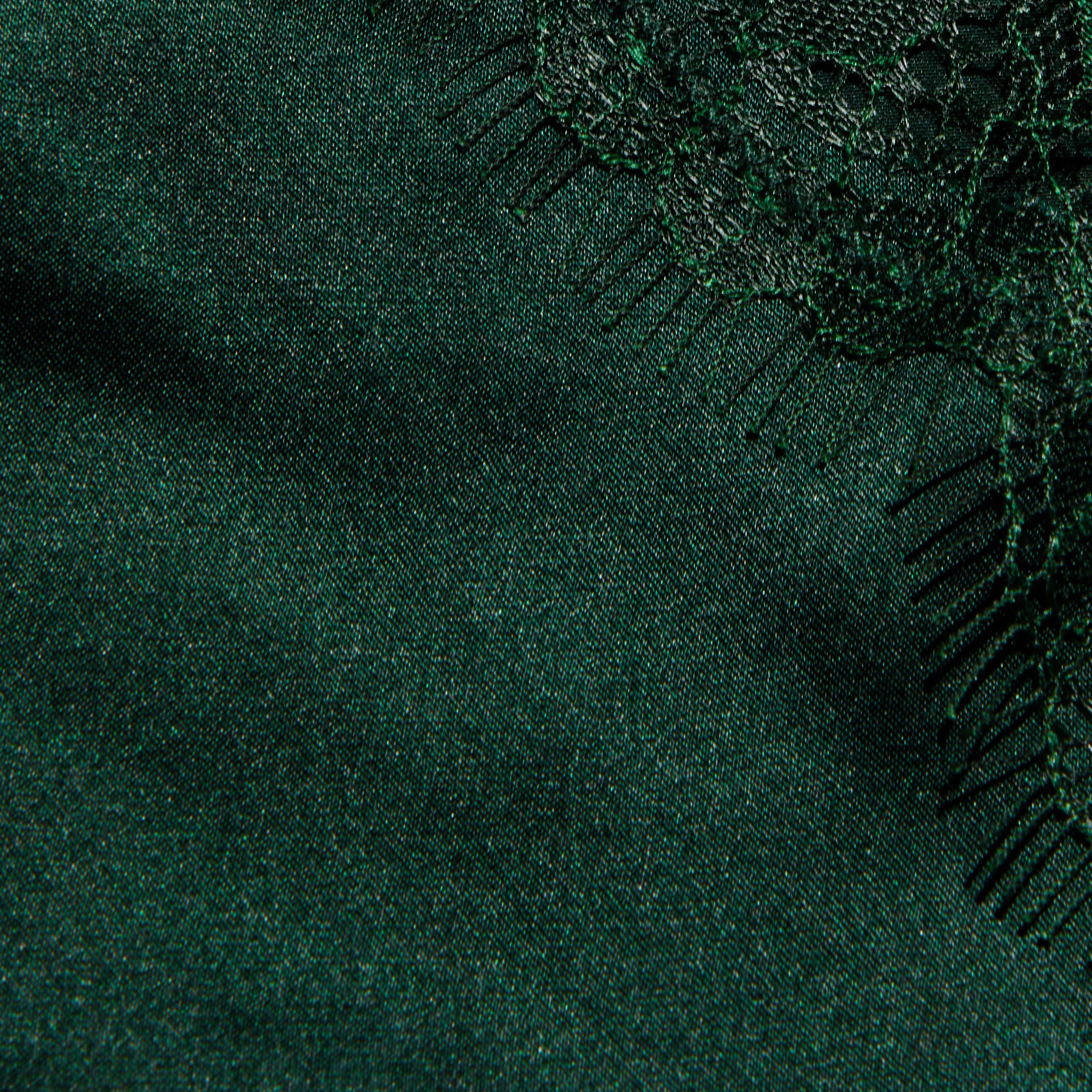 Close-up of the dark green Kimber Silk Lace Camisole, featuring a deep V-neckline and intricate lace trim along the edge.