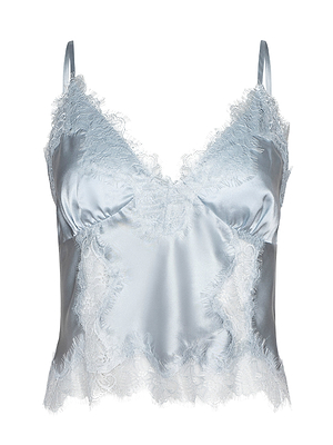 The Kimber Silk Lace Camisole is a light blue satin top with delicate lace accents on the neckline, hem, and sides. It features thin adjustable straps and a soft, shiny texture.