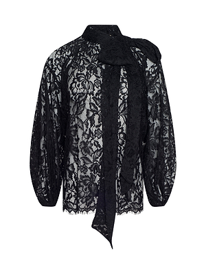 The Rhett Oversized Lace Blouse features a black sheer floral lace design, long sleeves, high neck, and a statement bow tie detail at the front for bohemian elegance.