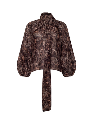 The Rhett Oversized Blouse by L’AGENCE features a paisley print, voluminous long sleeves, and an attached neck tie, offering a chic bohemian style in brown and black tones.