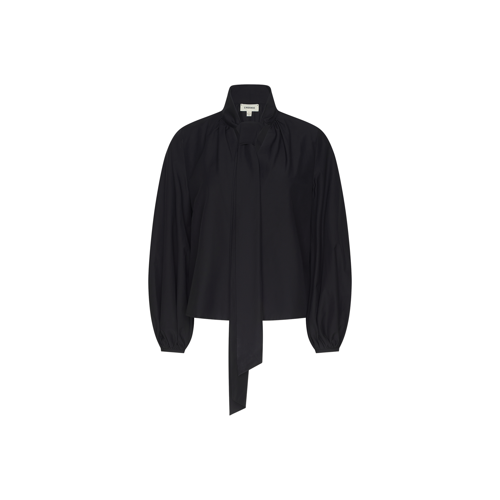The Deon Tie-Neck Blouse is an oversized, black long-sleeve top made from organic cotton poplin. It features a high neckline with a dramatic long tie, blouson sleeves with buttoned cuffs, and a relaxed fit, shown against a plain white background.