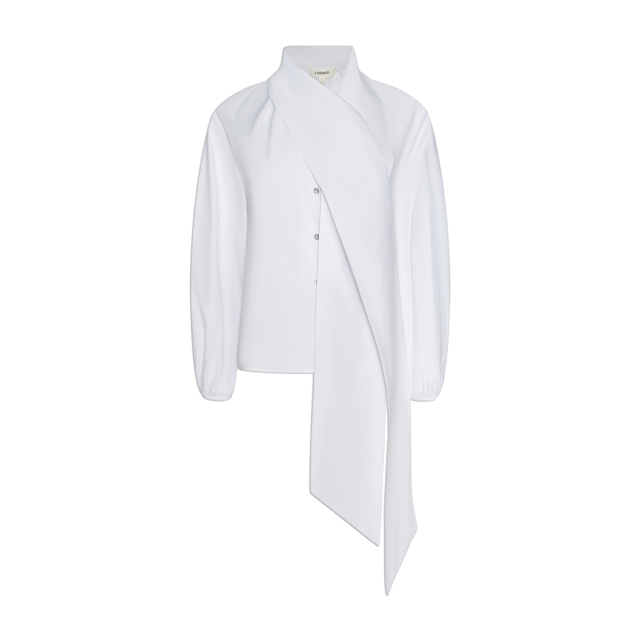 Introducing the Deon Tie-Neck Blouse, a white blouse crafted from organic cotton poplin. This piece features long blouson sleeves, a button front, and a dramatic asymmetrical draped tie-neck panel that extends from the collar down the front.