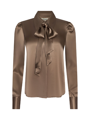 The Honey Silk Blouse is a brown silk charmeuse top with long sleeves, a large tie-neck bow, button-down front, and slightly puffed shoulders, shown against a white background.