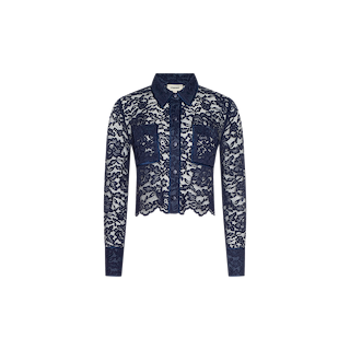 The Roelle Lace Blouse is a navy blue, long-sleeve cropped blouse crafted from sheer floral lace fabric. It features two front patch pockets, a collar, a button-down front, and is finished with a delicate scalloped hem.
