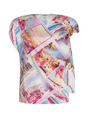 The Driselle Scarf Top is a colorful off-shoulder piece with a vintage postcard print in pink, blue, and yellow tones, accented by a gold ring on one shoulder—perfect for vacation wear.