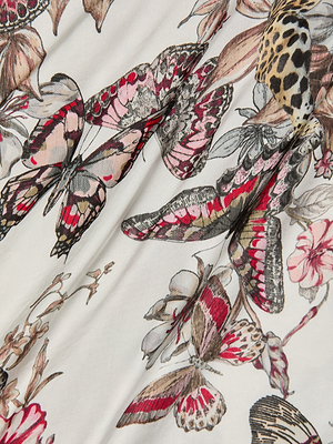 A close-up of the Eddie Tank’s fabric showcases a vibrant butterfly and floral print in pink, red, brown, and black on white. Butterflies and flowers overlap artfully, giving this tank a lively and detailed look.