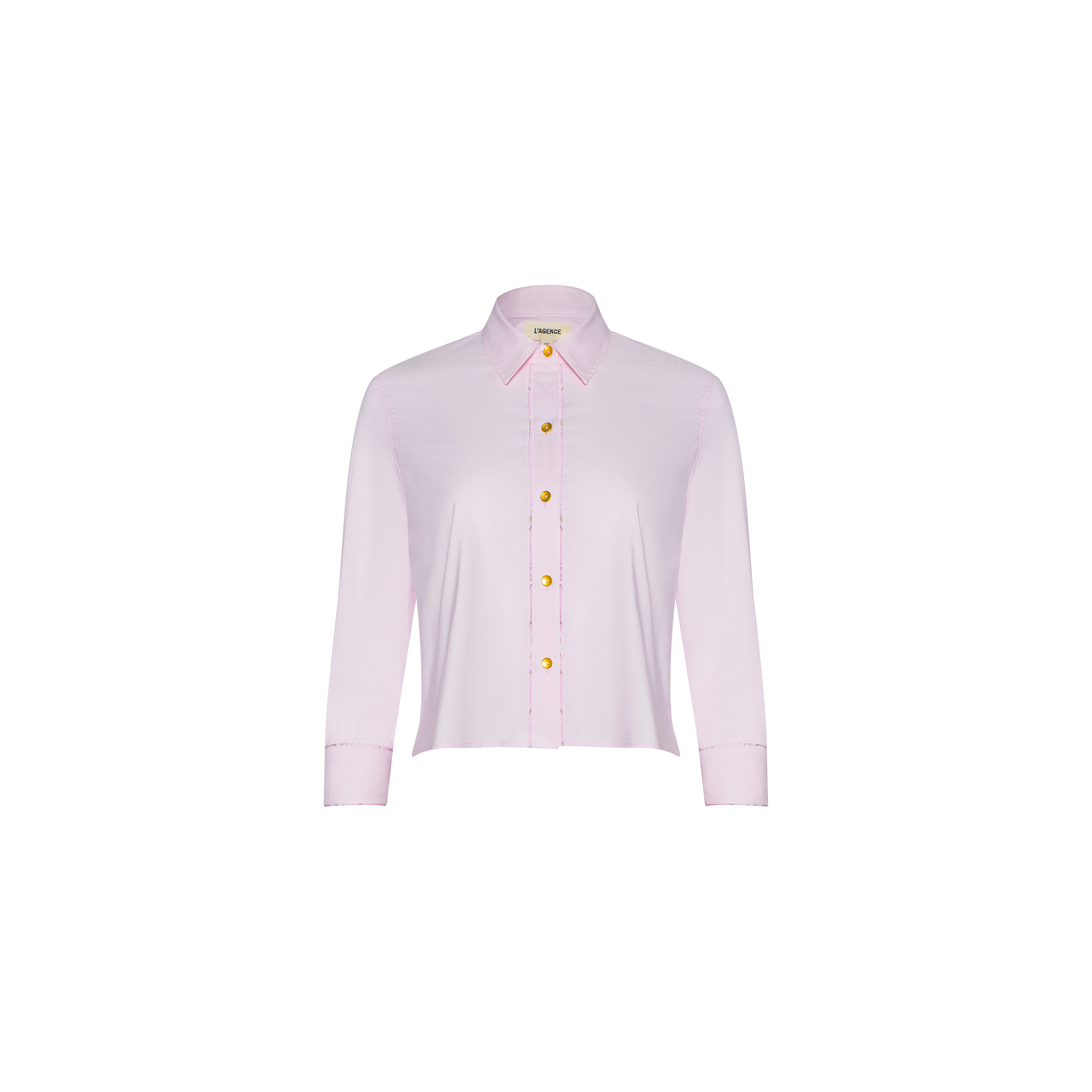 Fawn Shirt – a cropped pale pink shirt featuring long sleeves, a collar, and yellow buttons, displayed on a white background.