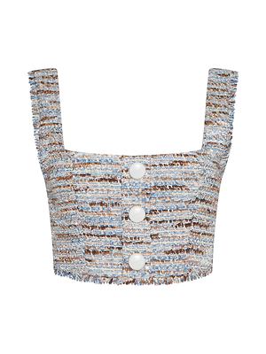 The Muno Tweed Top is a cropped style with wide straps, blue-white-brown textured tweed, three large white front buttons, and frayed edges for a chic raw hem.